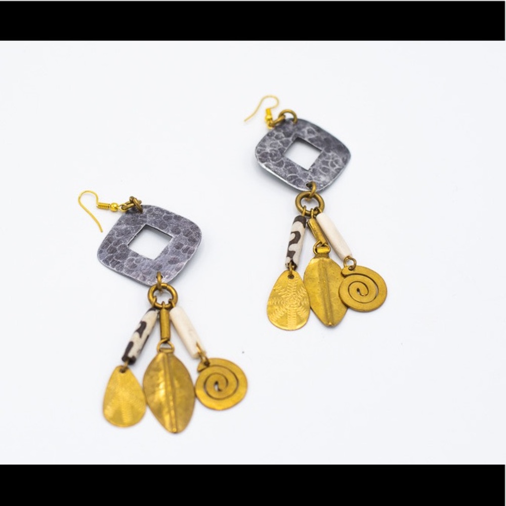 Handcrafted brass earring.